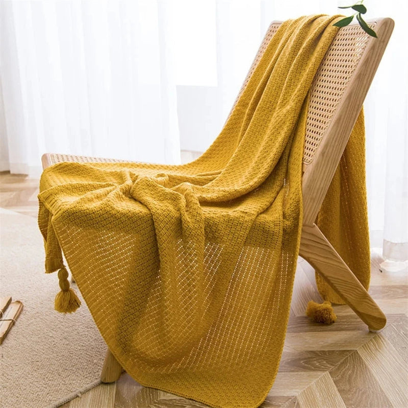 Manta de Malha com Borla - Conforto e Estilo para Seu Lar - Casa Farfelle