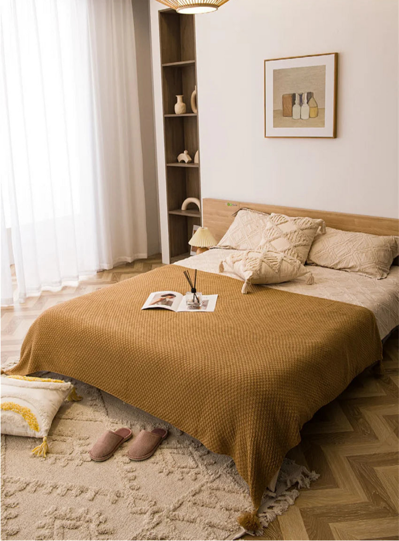 Manta de Malha com Borla - Conforto e Estilo para Seu Lar - Casa Farfelle